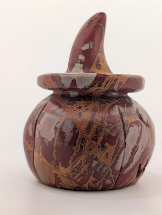 Red jasper pumpkin witch hat carving – side view