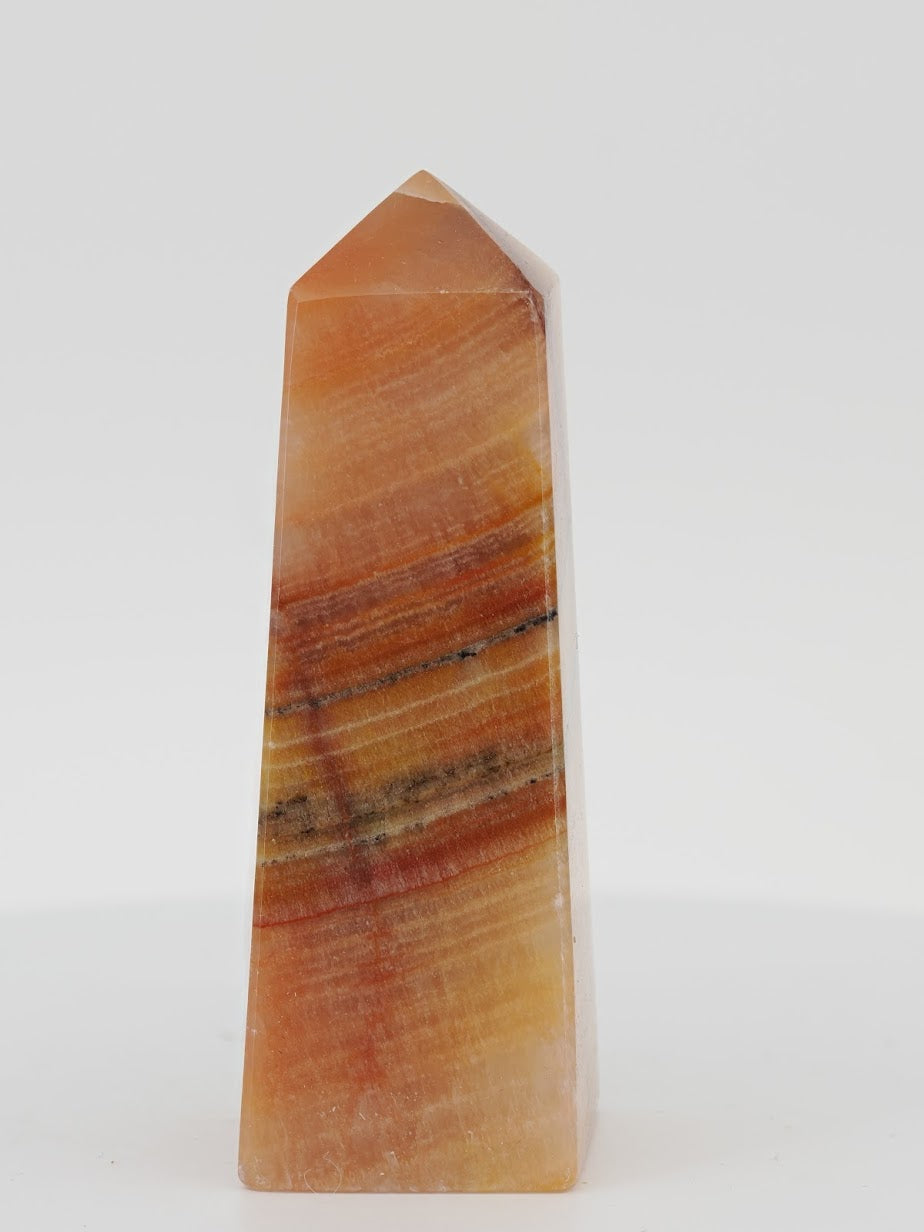 Polished Rose Calcite tower featuring vibrant pink manganoan layers, white aragonite, and natural mineral bands.