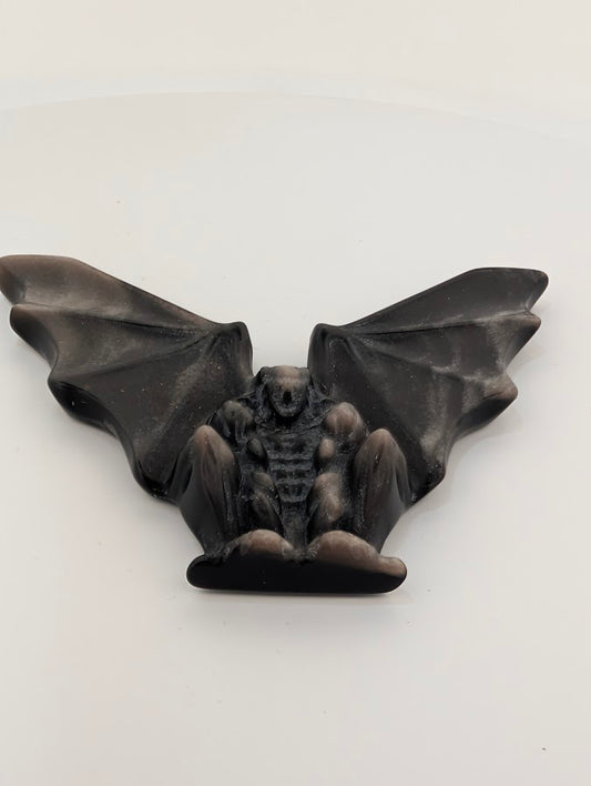 Silver obsidian gargoyle carving – angled view showing wings and body