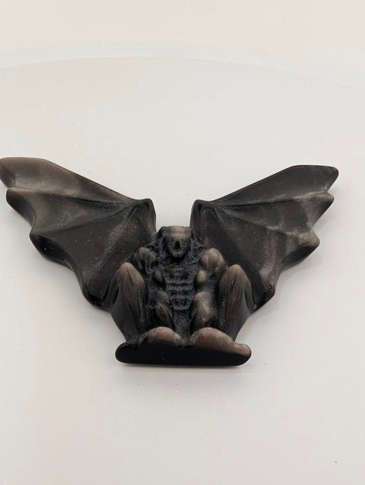 Silver obsidian gargoyle carving – angled view showing wings and body