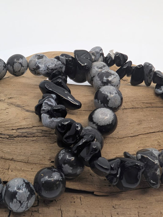 Close-up of Snowflake Obsidian bracelets showing black and white inclusions