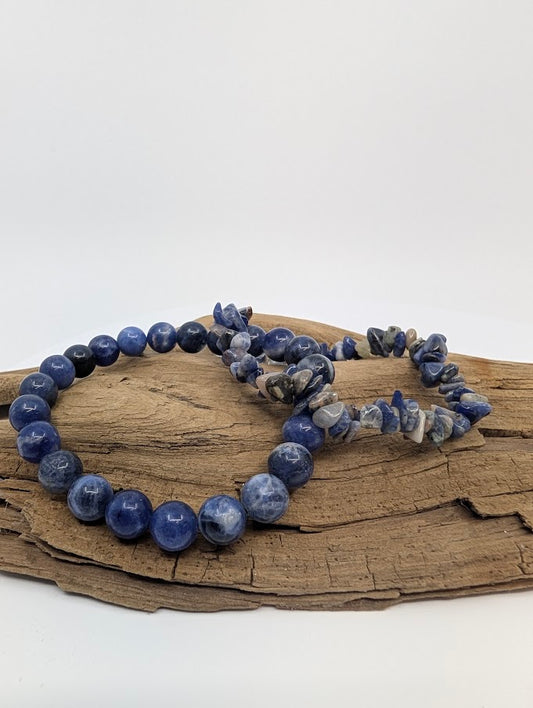 Sodalite bracelets in 8MM round beads and chip style displayed on wood
