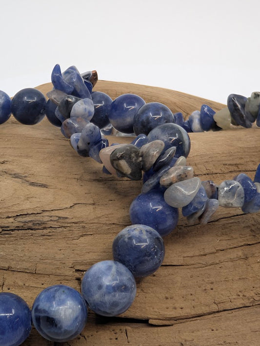 Close-up of sodalite chip and 8MM bead bracelet showing natural blue and white veining