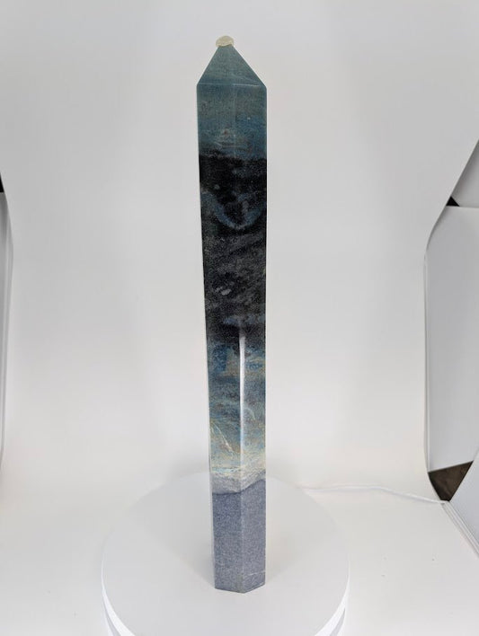 Side angle of Trollite tower TR-02 highlighting gradient from light teal to indigo