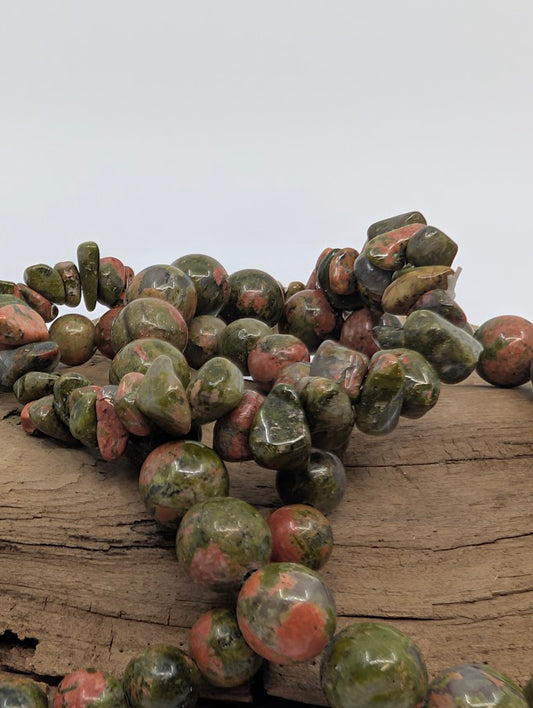 Close-up of Unakite bracelets showing green and pink tones