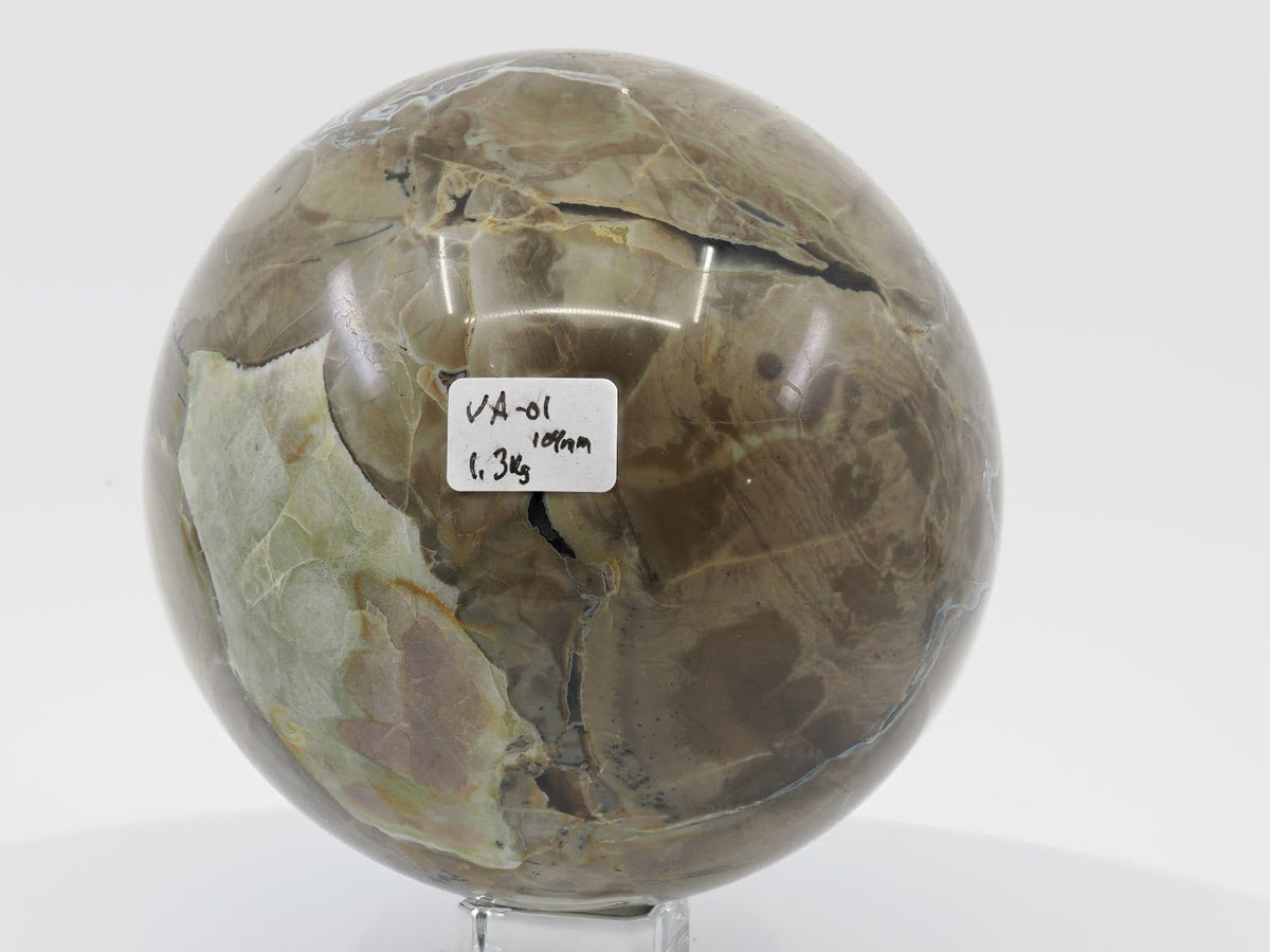 1.3kg Volcano Agate sphere with a distinct light green brecciated mineral inclusion and highly polished surface.