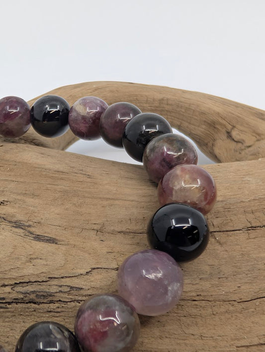 Close-up of 8MM Watermelon Tourmaline beads showing pink, green, and black colors