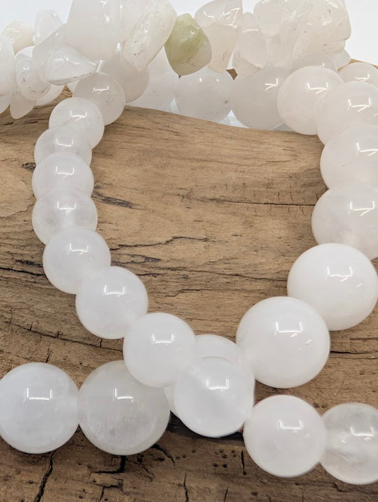 Close-up of polished 8MM White Jade bracelet beads
