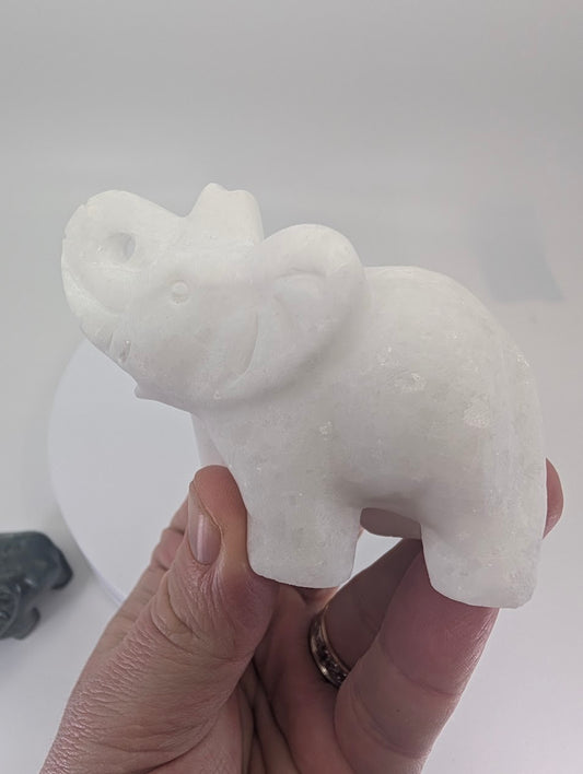 White Jade elephant carving, 215 g, in-hand view