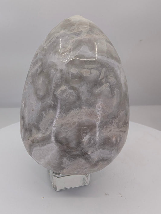 Polished white Mexican lace agate egg approximately 5 inches tall, smaller size