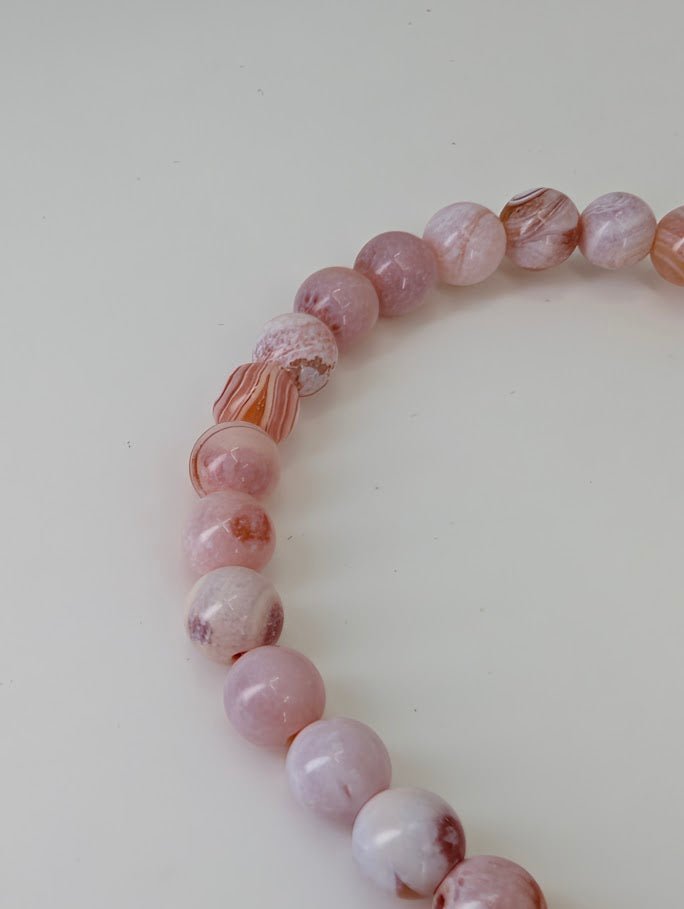 Detailed view showing natural eye patterns and pastel banding of Yancheng agate
