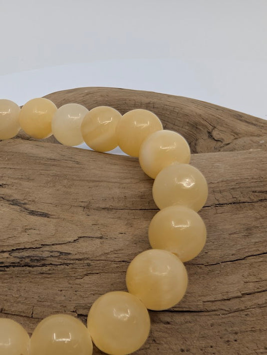 Close-up of polished Yellow Calcite beads, 8MM bracelet