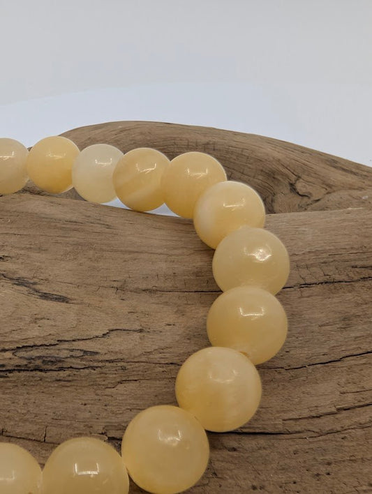 Close-up of polished Yellow Calcite beads, 8MM bracelet