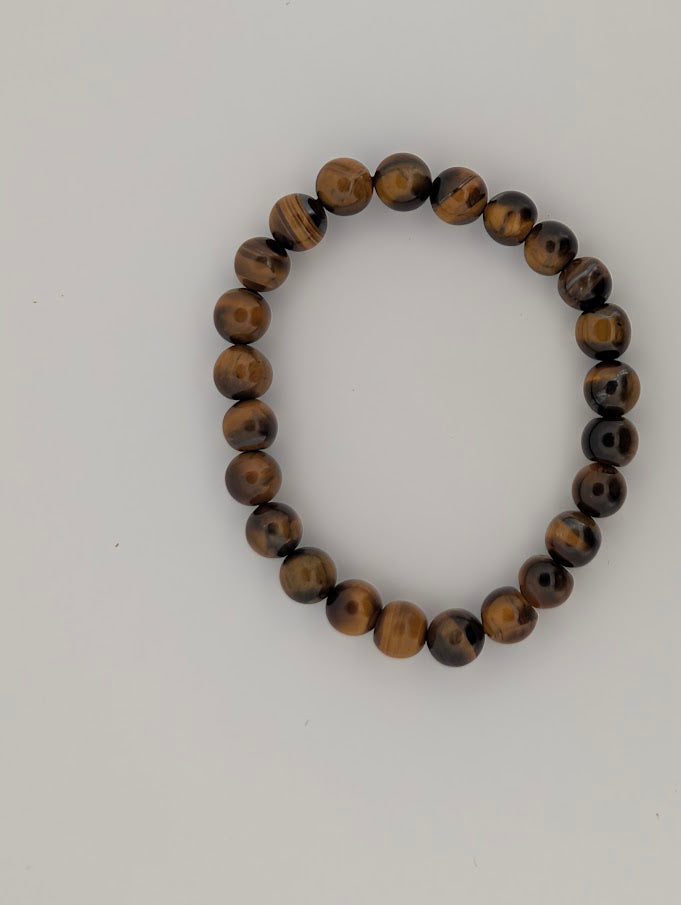 Top view of 8MM Yellow Tiger Eye bracelet with warm golden brown tones