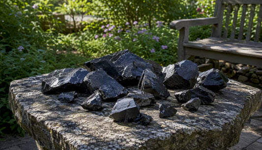 Raw shungite stones on natural wood surface