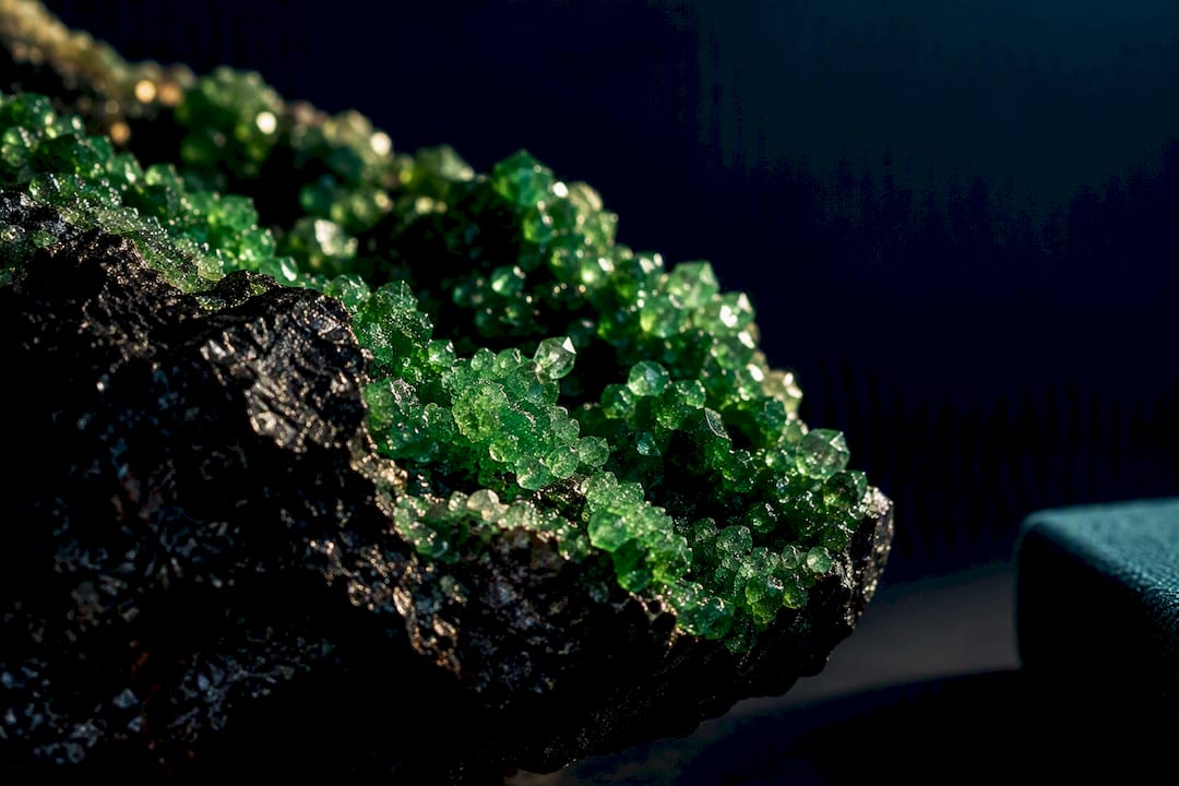 Emerald uvarovite crystals on dark chromite matrix