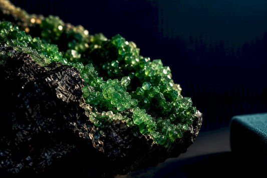 Emerald uvarovite crystals on dark chromite matrix