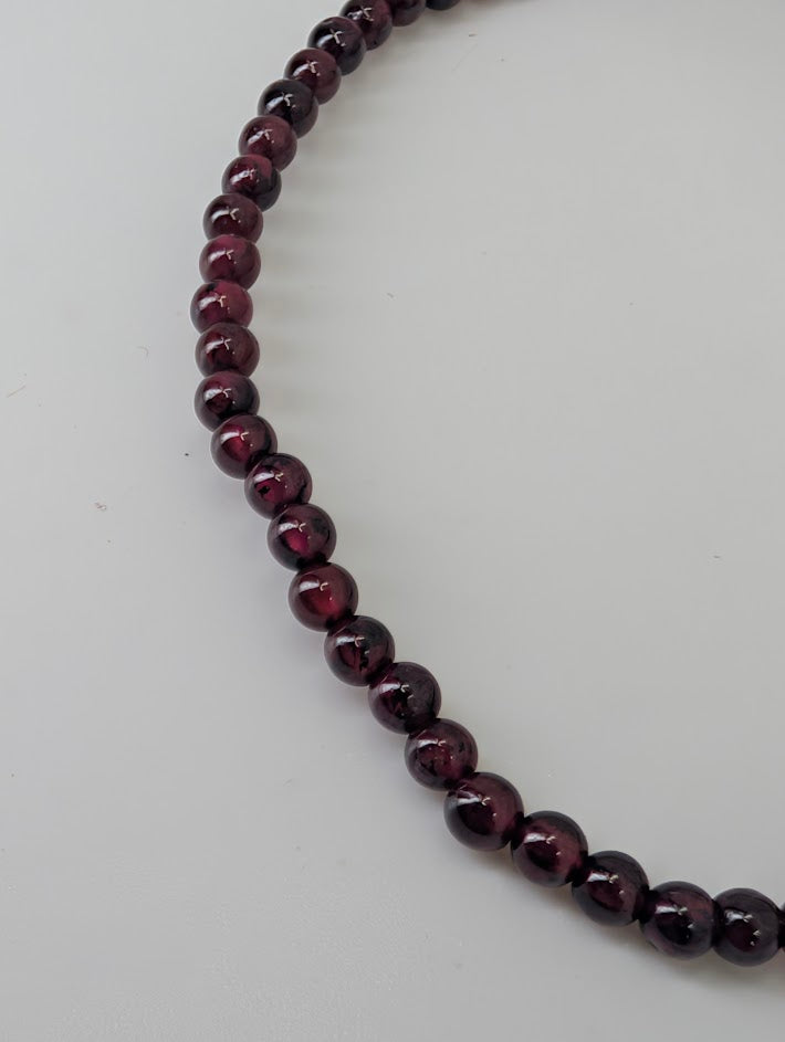 3mm garnet bracelet closeup