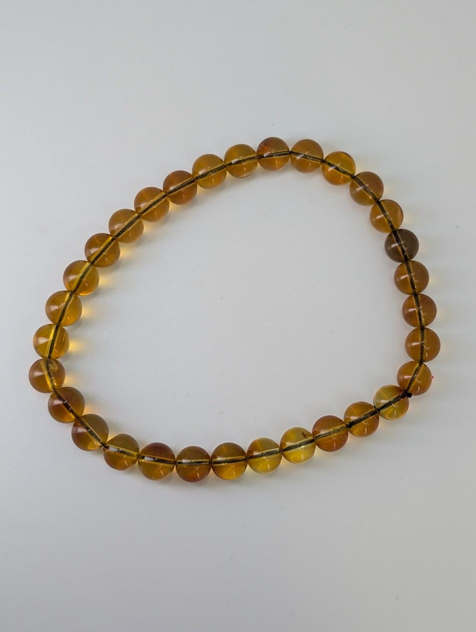 Mexican blue amber bracelet on white background