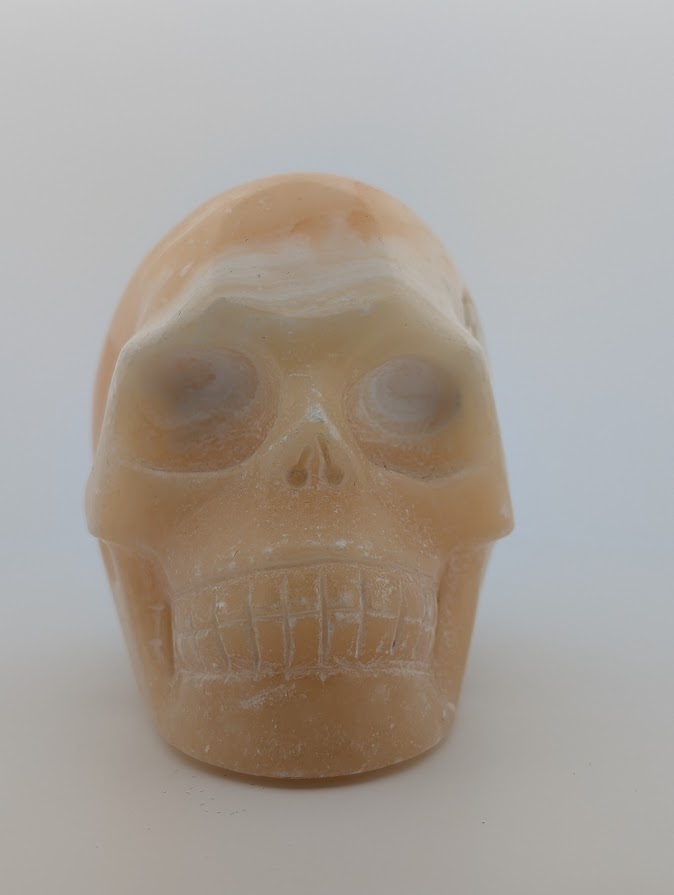 Orange Calcite Crystal Skull ~500g hand-carved carving with warm orange glow