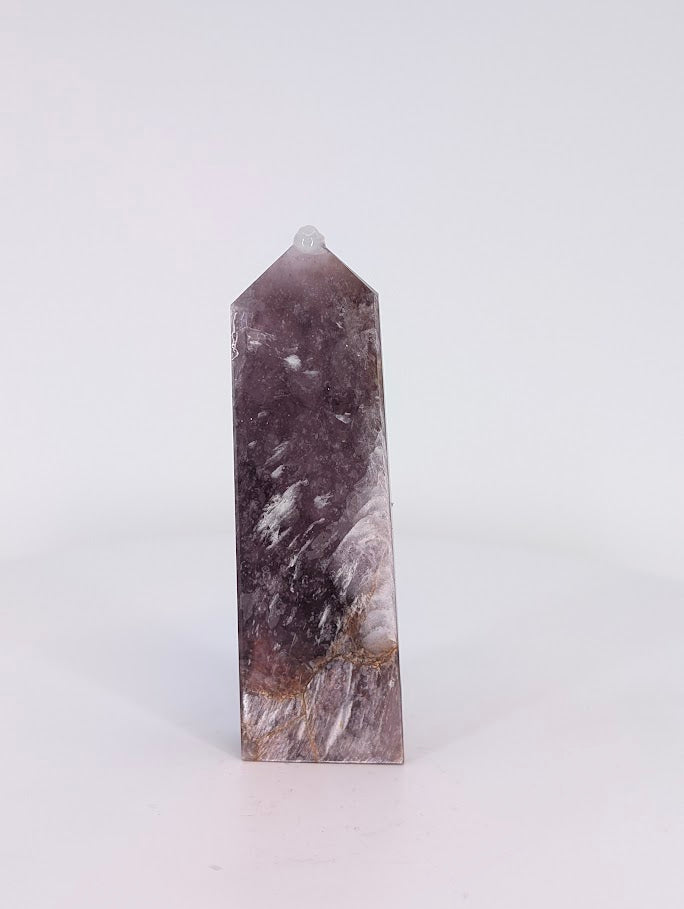 Front view of Purple Mica Tower from Madagascar – 8.8 cm (3.46 in) tall, 58 g (0.13 lb). Shimmering lavender and silver layers under polish.