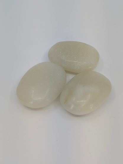 Afghan Jade palm stones with soft milky tone and subtle shimmer, natural polished finish front view