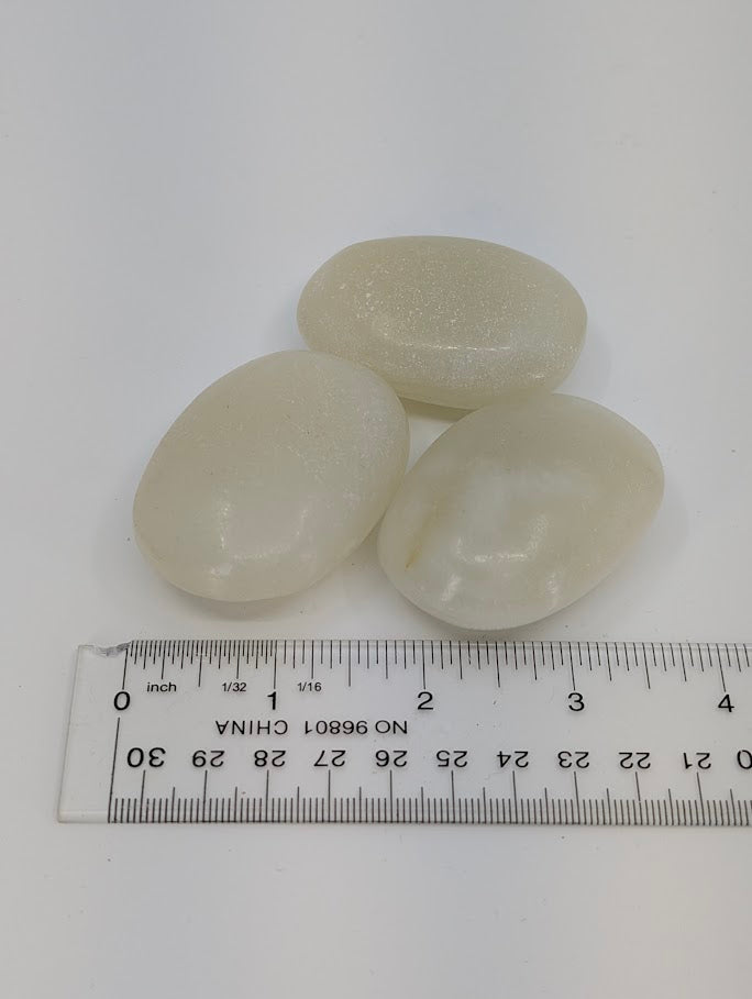 Afghan Jade palm stones with measuring scale showing size and shape