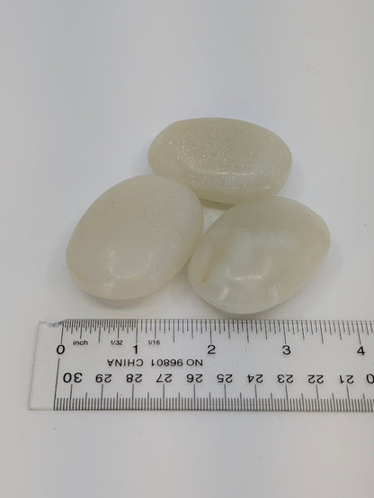 Afghan Jade palm stones with measuring scale showing size and shape