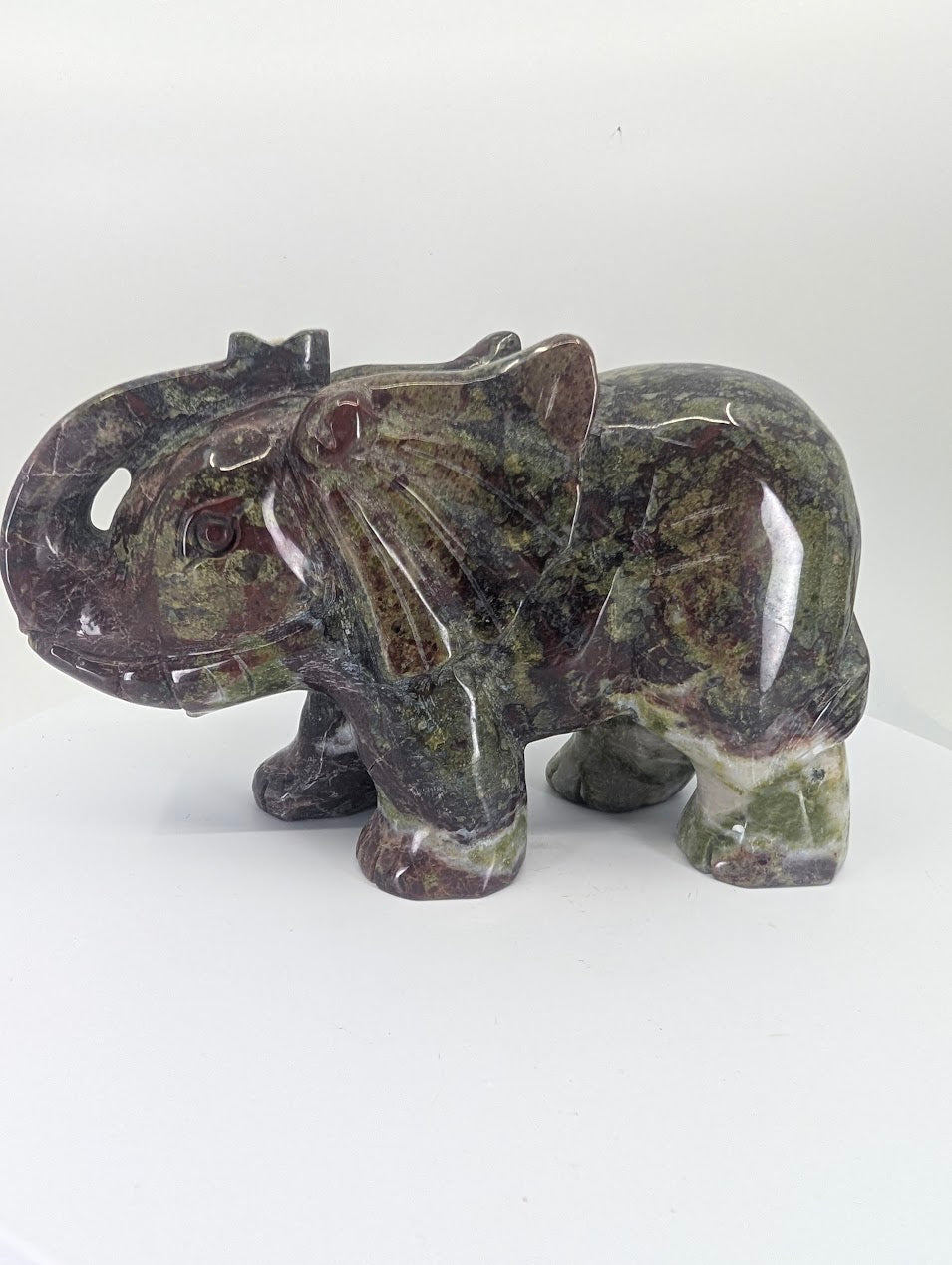 African Bloodstone elephant carving, left side view