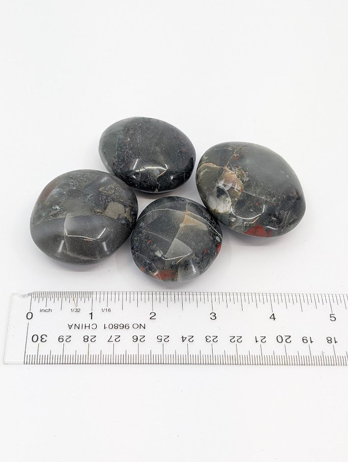 African Bloodstone group with ruler scale