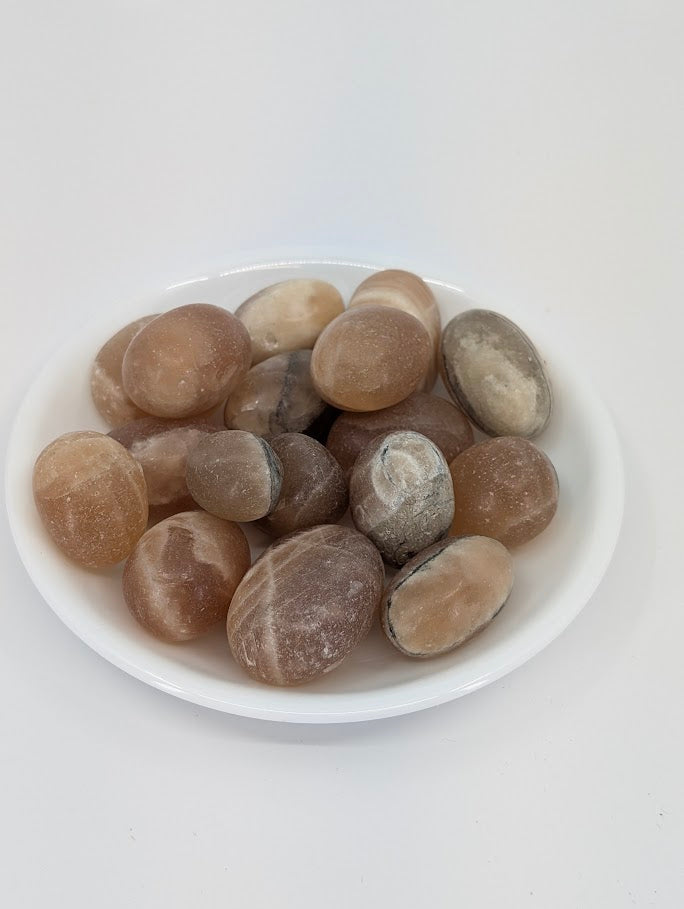 Amber Calcite tumbled stones from Mexico