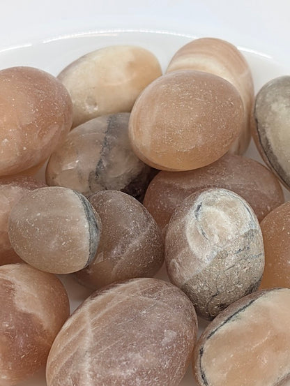 Close-up of golden brown and cream banding in Amber Calcite