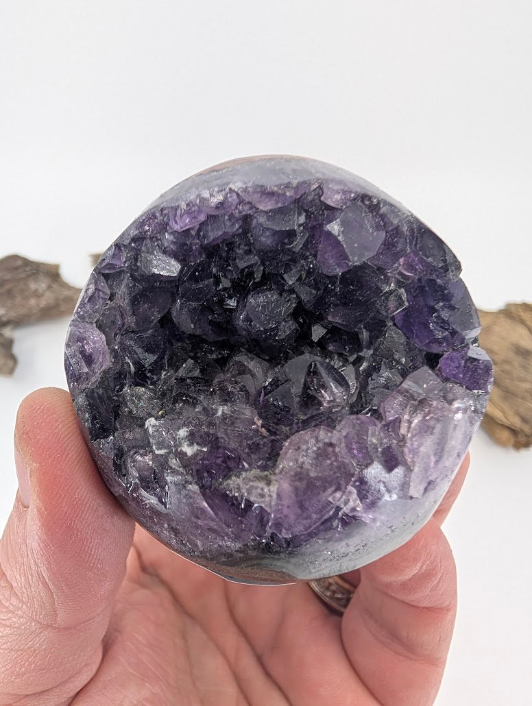 Hand-held view of small Amethyst sphere Specimen F.