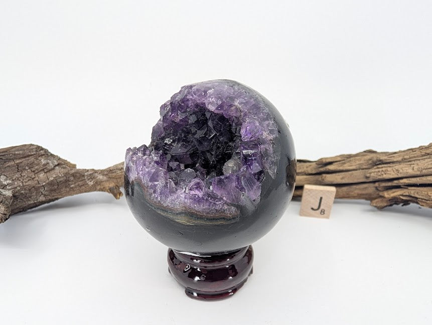 Angled view of Specimen J showing deep purple crystal clarity.