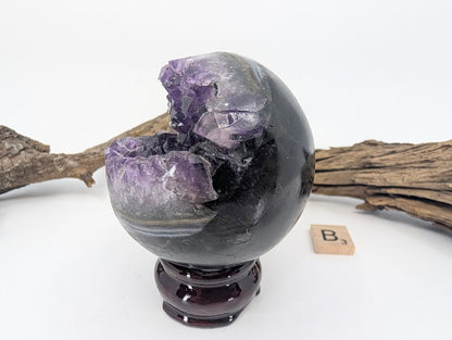Angled view showing crystal formation inside Amethyst sphere (Specimen B).