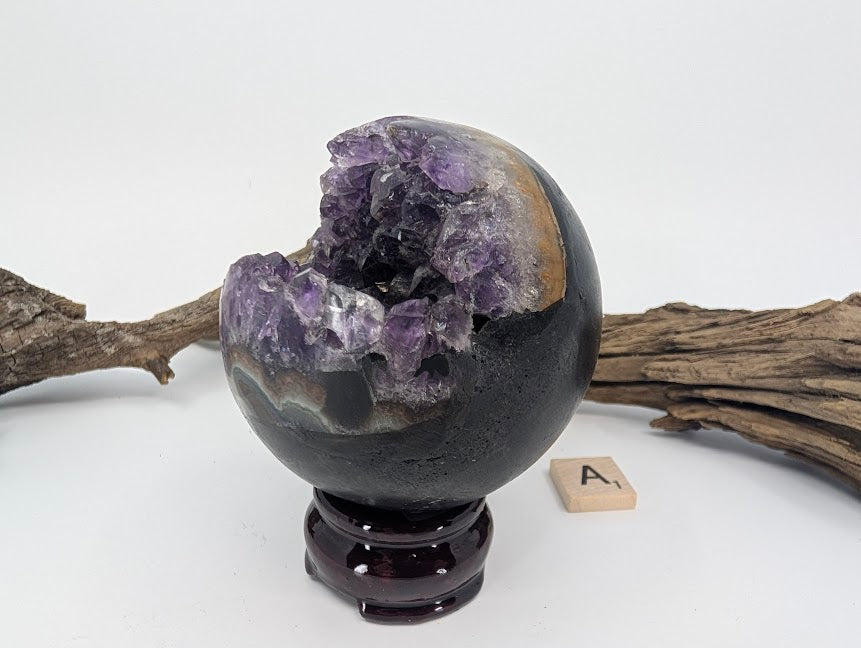 Front view of Uruguayan Amethyst Pac-Man sphere (Specimen A) on stand.