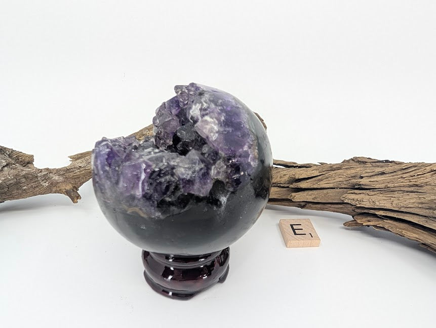 Side angle view of Amethyst sphere Specimen E showing crystal interior.