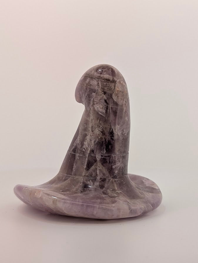 Angled view of amethyst witch hat carving