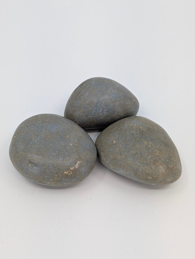 Angelite palm stones in soft blue-grey tones, natural matte finish front view