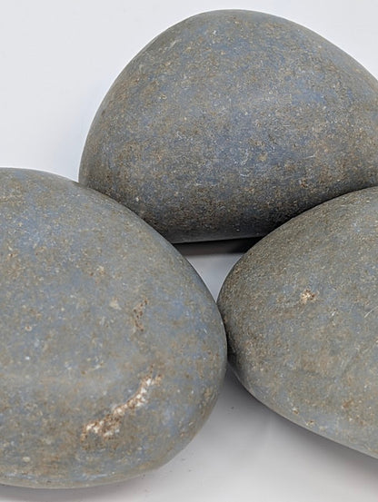 Angelite palm stones close-up showing smooth surface and gentle blue coloration