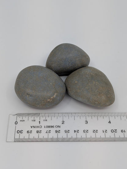 Angelite palm stones with measuring scale showing size and shape