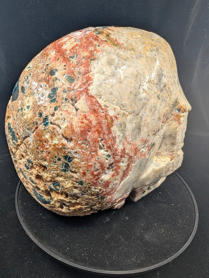 Right side profile with strong jasper reds and green-blue apatite