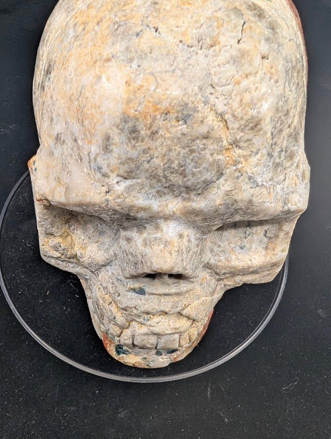 Top view showing broad apatite glow and sunstone shimmer across the crown