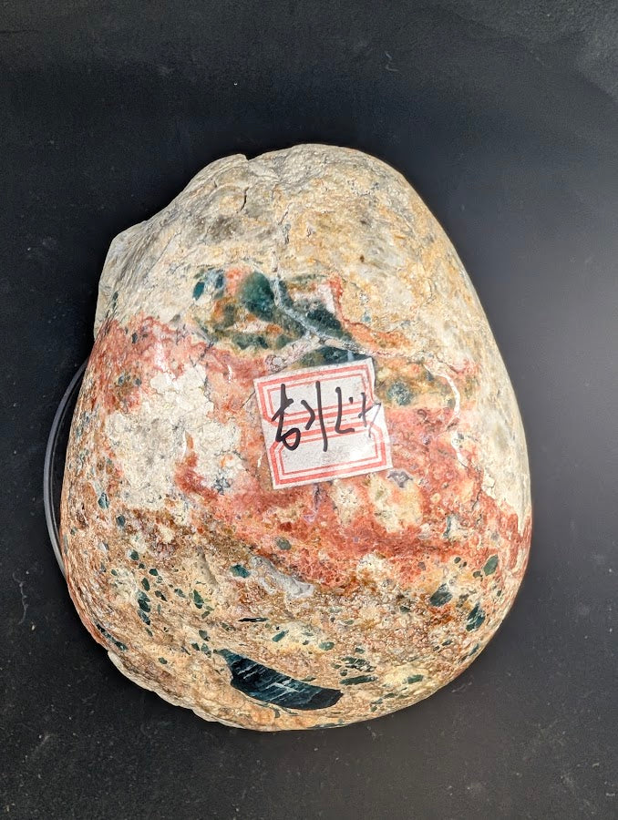 Top view showing broad apatite glow and sunstone shimmer across the crown