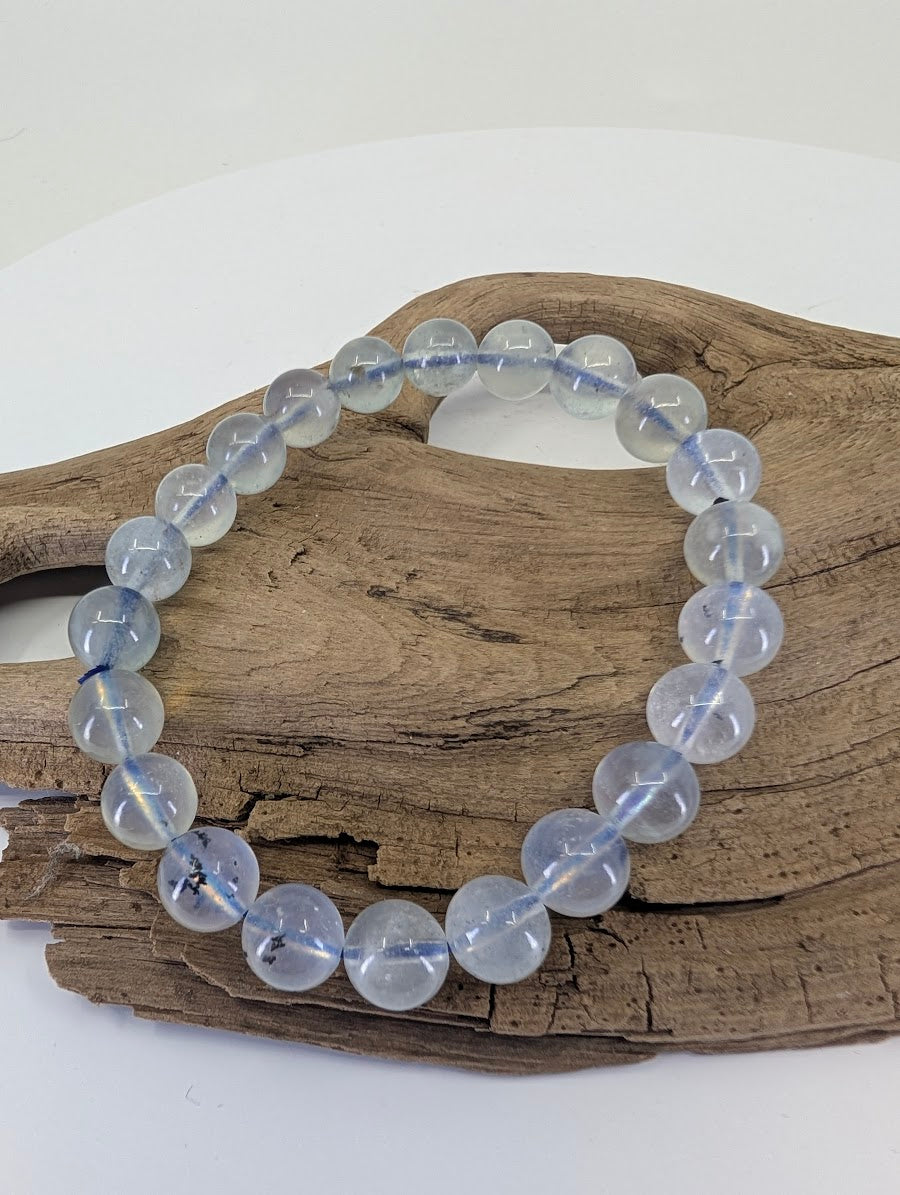 8mm Aquamarine bead bracelet from Brazil highlighting the substantial "Collector Grade" weight and saturation.