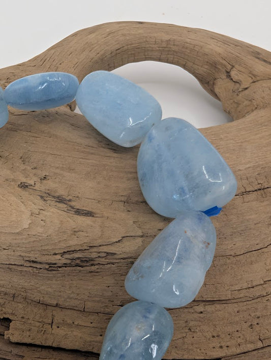 Close-up of Aquamarine bracelet highlighting translucent sky-blue color