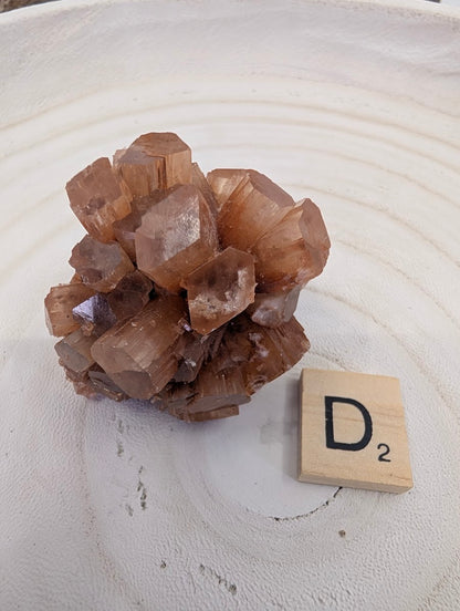Small 65g Aragonite Star Cluster specimen with high-luster terminations and honey-amber color.
