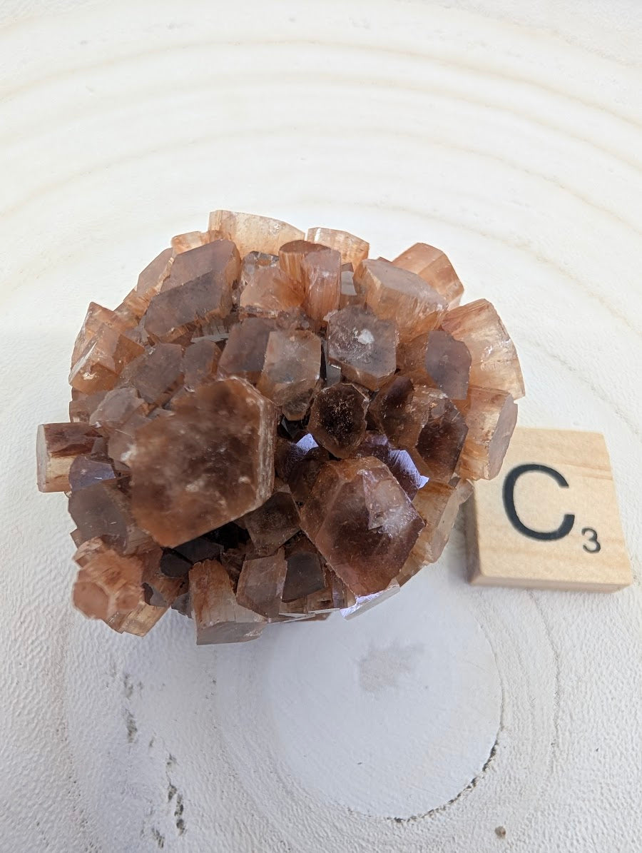 AA Grade Aragonite Star Cluster, 90g, featuring dense radial crystal growth and earthy tones.