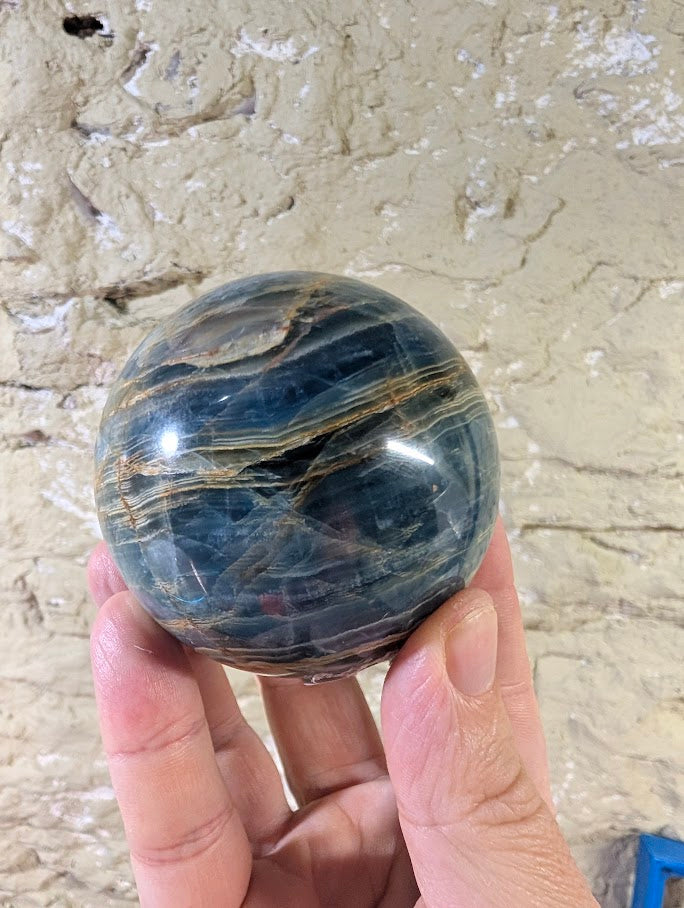 70mm blue calcite sphere with golden veining – front view