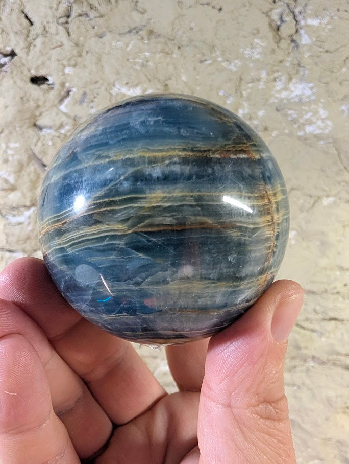 Polished and raw textures of Argentina blue calcite sphere